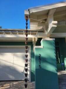 Sarasota’s tropical climate brings frequent afternoon showers and seasonal storms. Rain chains offer a unique way to manage water flow while adding an elegant design element to your exterior.