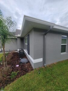 Charcoal Grey Downspouts Installation in Cape Coral FL with Gutter Professor